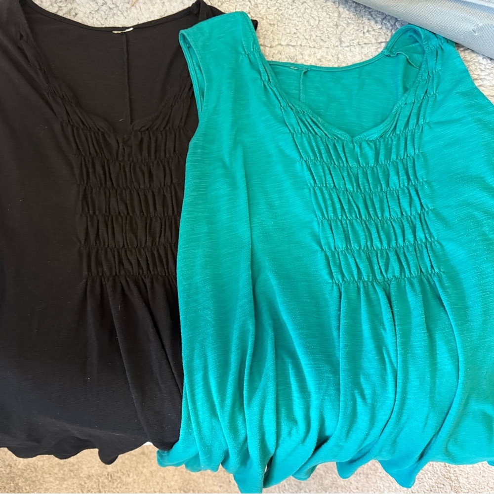 Two Women's Black and Teal Sleeveless Tops